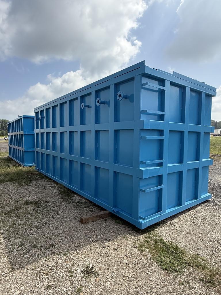 Three-quarter view of a blue EnviroBox tank with flanged end nozzles and ladder rungs